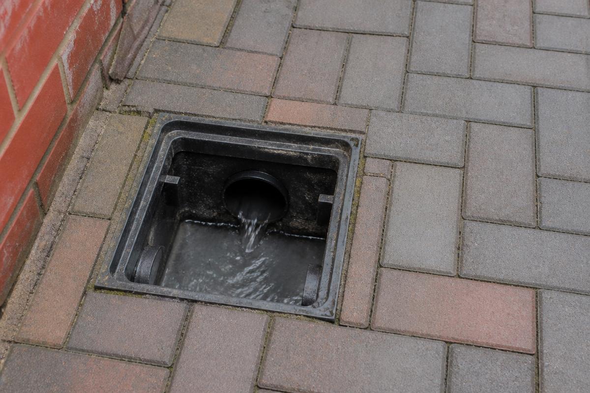 Same outside drain now clear with water flowing freely after unblocking